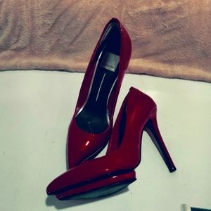 Red patent leather pumps